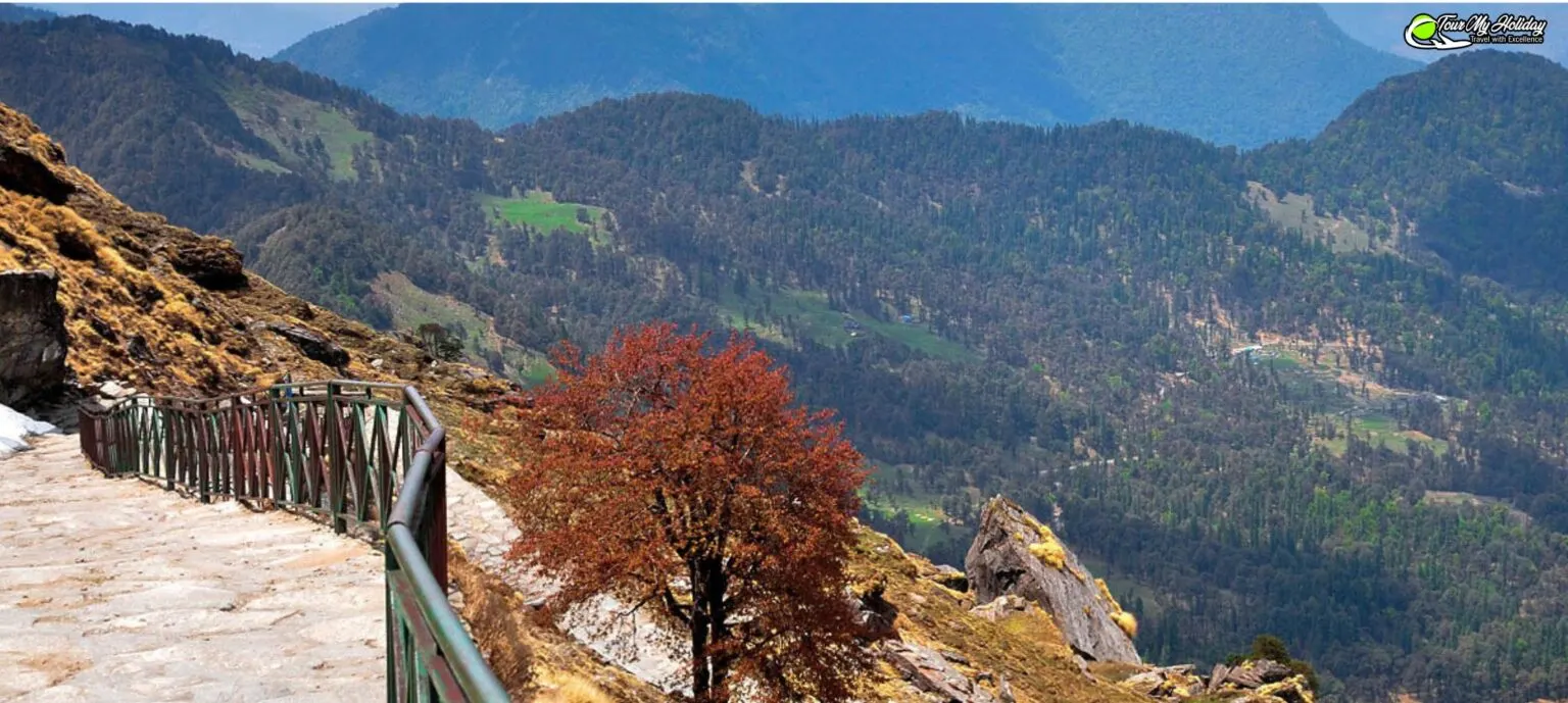 Scenic view of Tungnath Trek in Uttarakhand showing pilgrims and trekkers on Himalayan path with snow-capped peaks